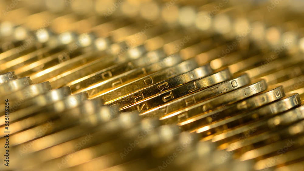 rows of golden coins lie on the table. rows of golden coins lie on the table.