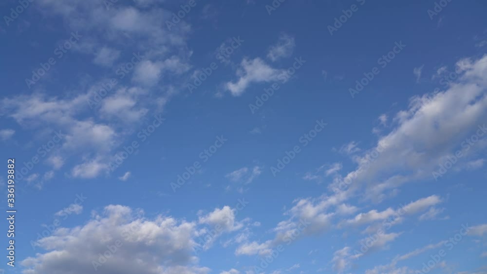 Video time lapse of beautiful clear sunny blue sky with soft fluffy white clouds moving alone. Natural background. Video time lapse of beautiful clear sunny blue sky with soft fluffy white clouds moving alone. Natural background.