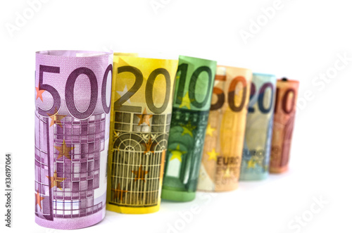 different euros twisted into a roll on a white background. Business concept.