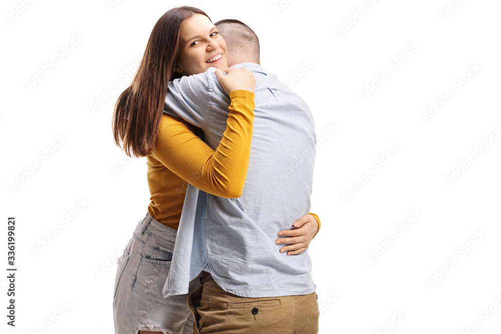 Naklejka premium Young man and woman hugging each other