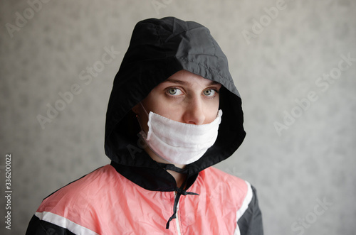 Tired disinfector in a protective suit and mask sprays disinfectants in house or office. Protection agsinst COVID-19 disease. Prevention of spreding pneumonia virus with surfaces. Coronavirus Pandemi photo