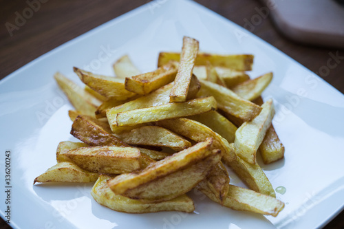 Picture of golden fries on a white plate