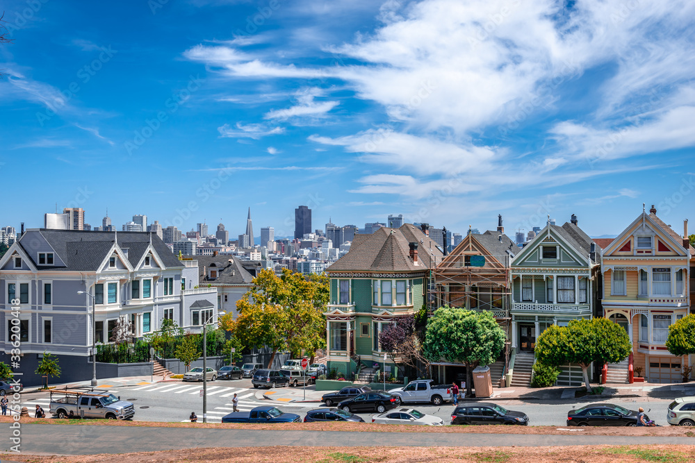 The painted Ladies in Steiner Street facing Alamo Square and the modern city skyline.