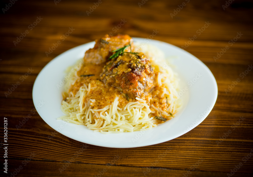 boiled vermicelli with meat and gravy in a plate boiled vermicelli with meat and gravy in a plate