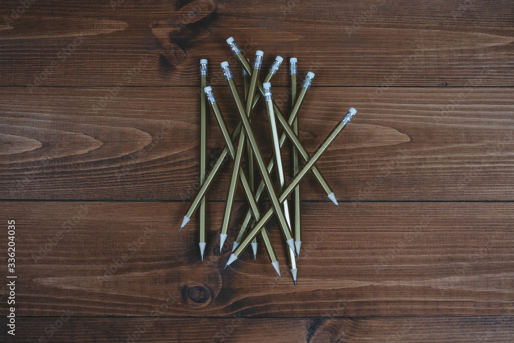 Simple pencils with an eraser on brown boards. Simple pencils with an eraser on brown boards.