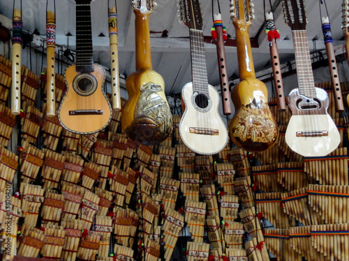 venta de instrumentos musicales artesanales en un mercado de Perú photo