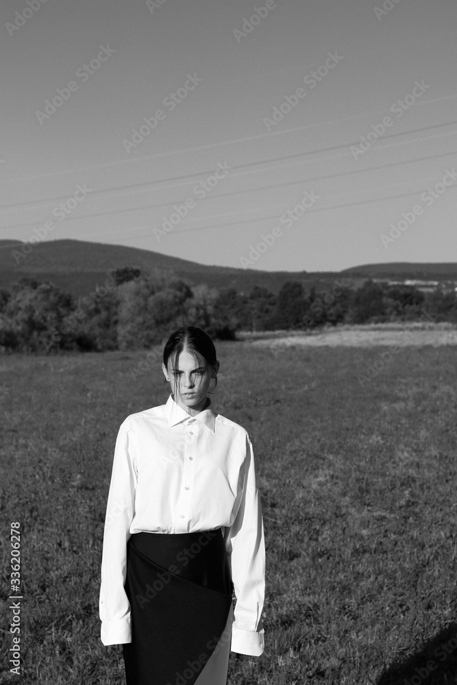 Romantic and artistic photo of a model posing in nature.