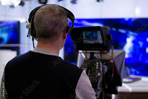 Professional cameraman working in a TV Studio. © andreysha74