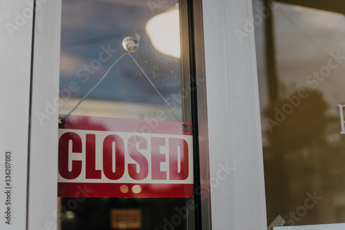 A closed sign on a shop window photo
