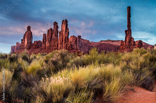 totem pole in monument valley at sunset photo
