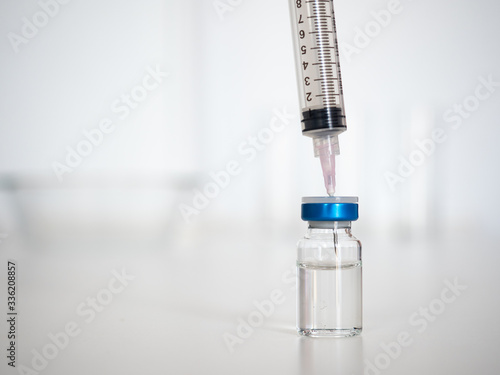 Syringe and vial, isolated on a white background. Prevention against diseases and viruses.