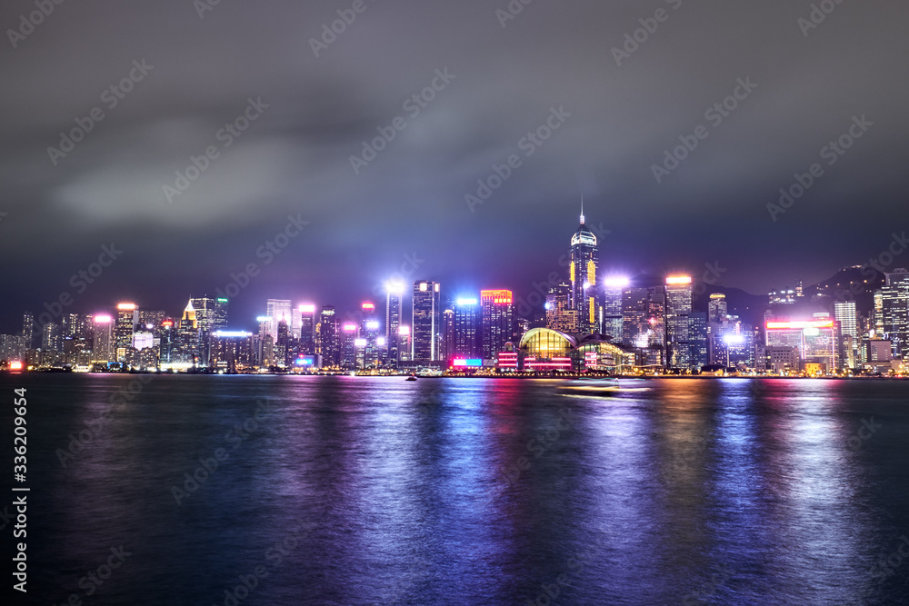 Naklejka premium View of Victoria Harbor and Hong Kong at night. Urban landscape.