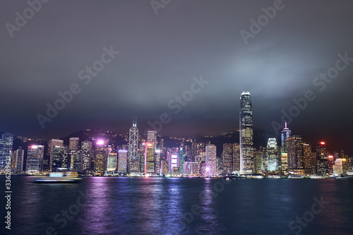 View of Victoria Harbor and Hong Kong at night. Urban landscape.