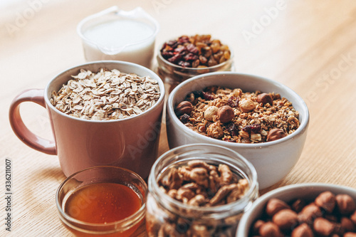 homemade granola for breakfast and the ingredients from which it is prepared, top view