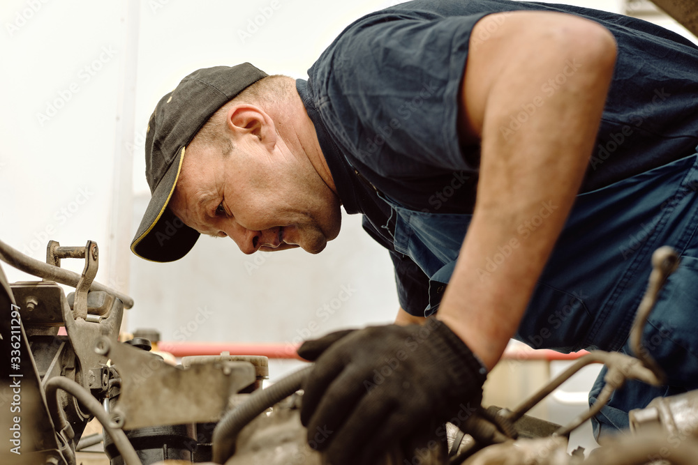 Repairman Doing Vehicle Health Check Repairman Doing Vehicle Health Check