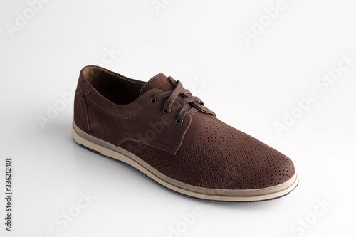 Brown men leather shoe with shoelaces on white background