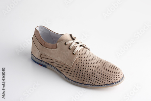 Brown men leather shoe with shoelaces on white background