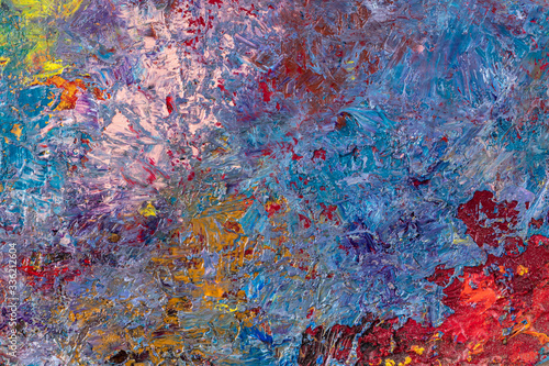 Abstract background of multi-colored stains of oil paint
