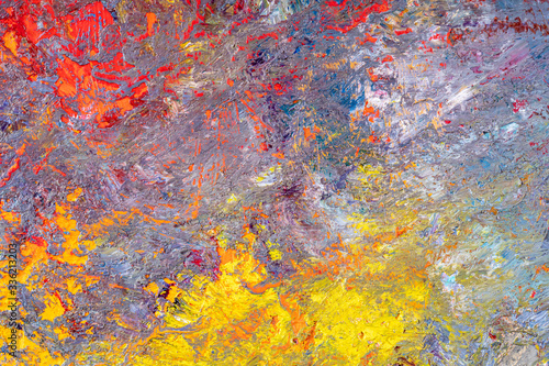 Abstract background of multi-colored stains of oil paint