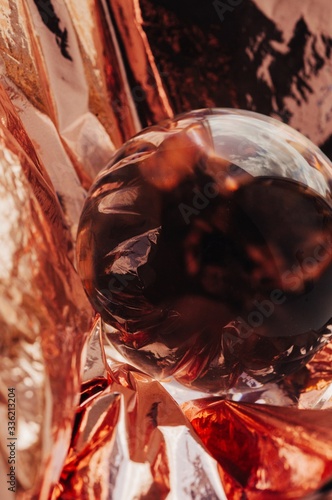 Pink gold or copper and crystal ball abstract shot photo