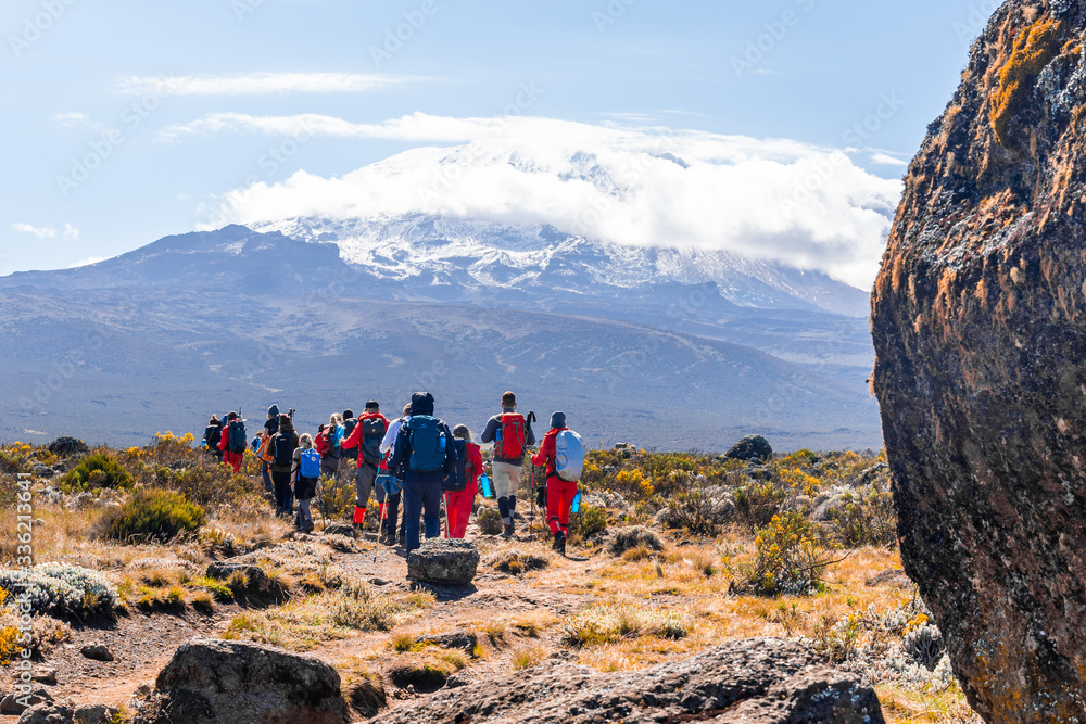 Φωτογραφία Group of trekkers hiking among snows and rocks of Kilimanjaro mountain