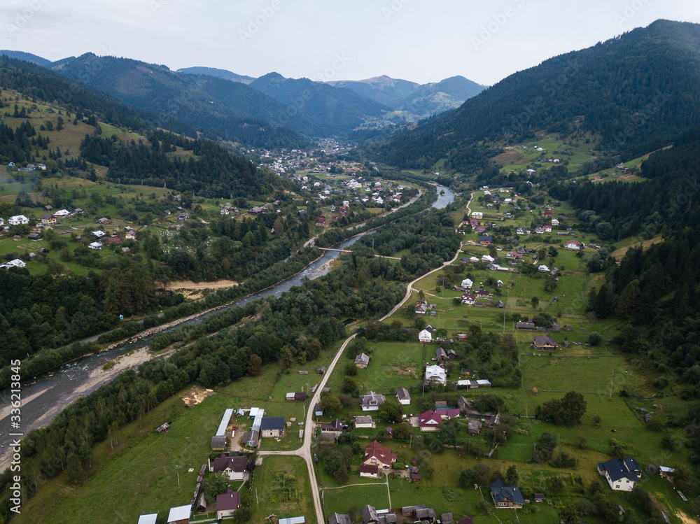 Famous green tourism village Kryvorivnia in Carpathians mountains at summer, typical landscape in Hutsulshchyna National Park in Ukraine