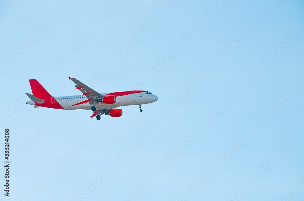 A beautiful corporate plane flies in the sky, a clear day in Portugal, tourist transport and mail delivery. bottom view. A beautiful corporate plane flies in the sky, a clear day in Portugal, tourist transport and mail delivery. bottom view.