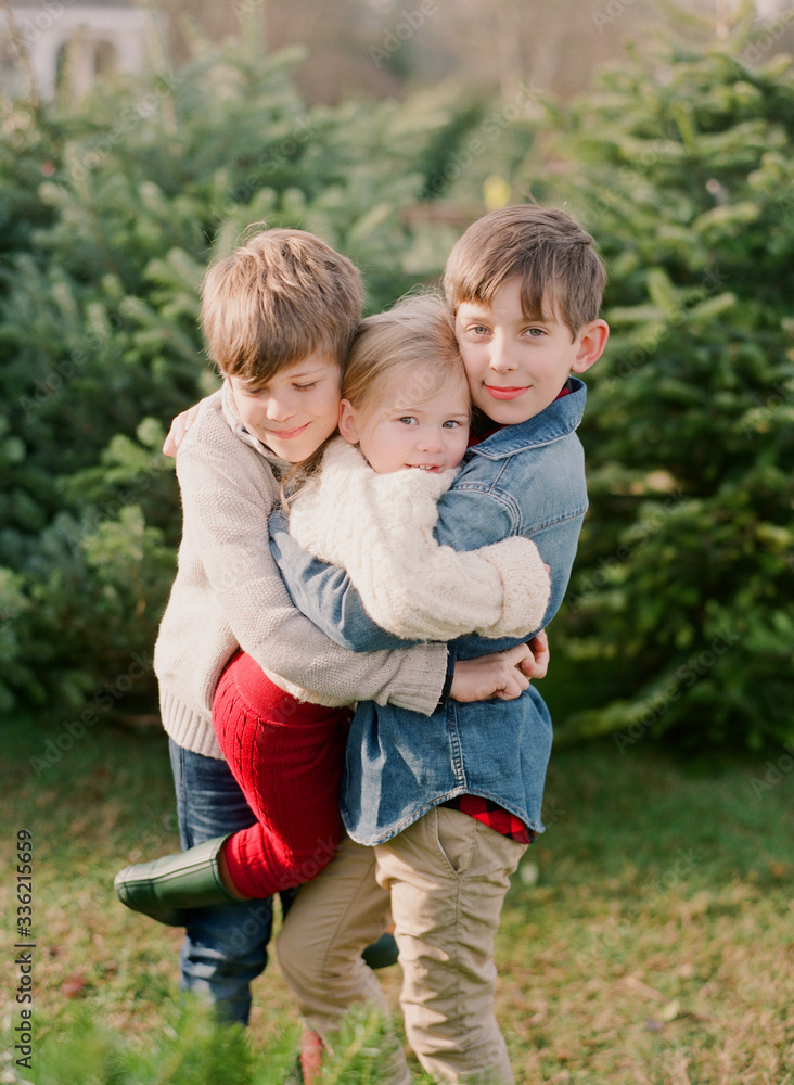 young family at christmas tree farm cutting christmas tree young family at christmas tree farm cutting christmas tree