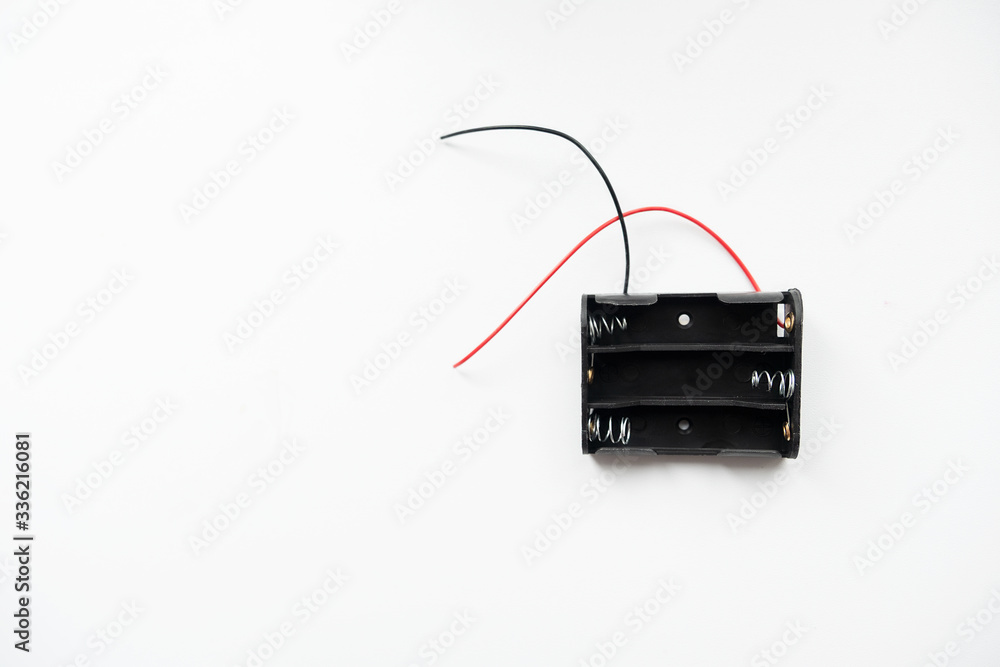 battery compartment with wires, on a white background, top view.
battery compartment with wires, on a white background, top view.