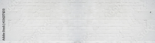 White bright painted damaged rustic brick wall texture banner panorama