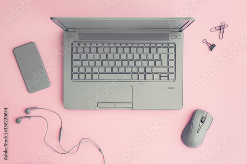 Office workspace on pink photo
