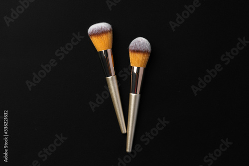 Collection of make up brushes on black background, close up