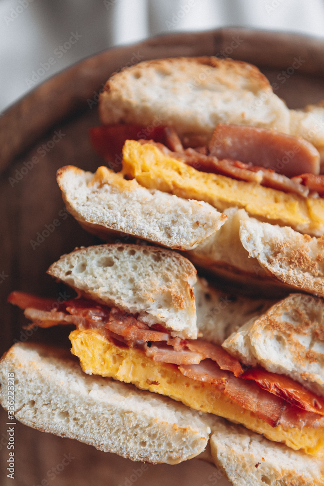 delicious and appetizing breakfast: a bagel stuffed on a plate delicious and appetizing breakfast: a bagel stuffed on a plate