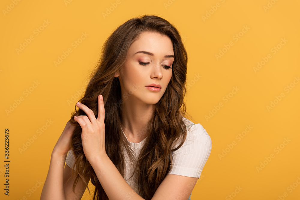 beautiful tender spring woman with long hair isolated on yellow beautiful tender spring woman with long hair isolated on yellow