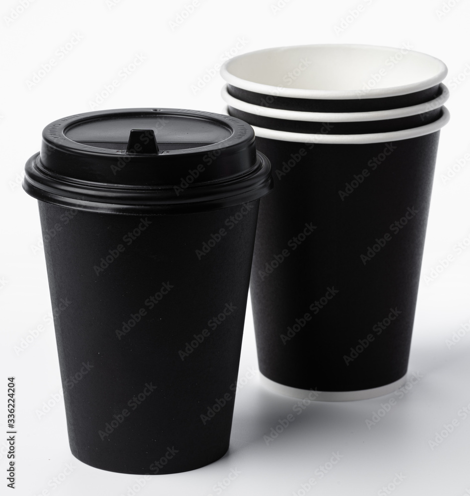 Paper coffee cups isolated on white background. Close up. Paper coffee cups isolated on white background. Close up.