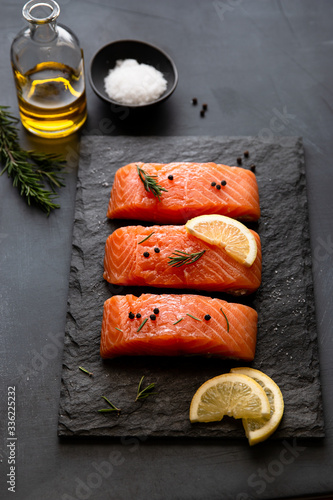 Salmon with lemons, rosemary and peppercorns photo