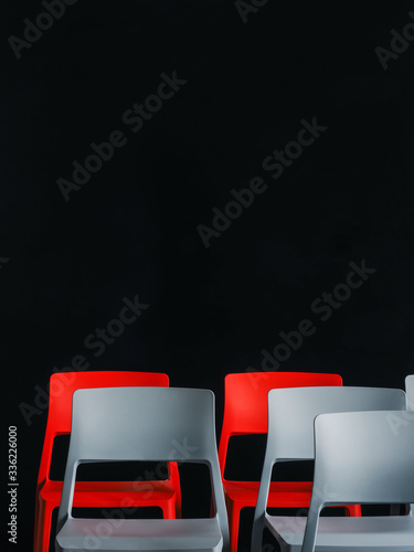 Gray and red chairs in lecture hall