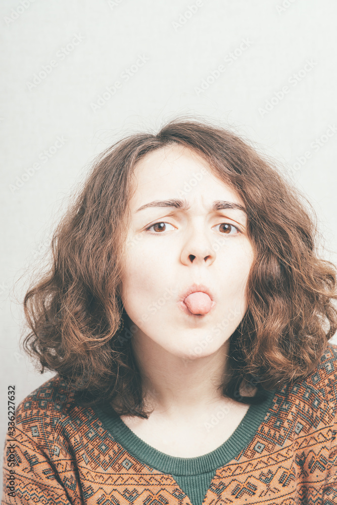girl shows tongue