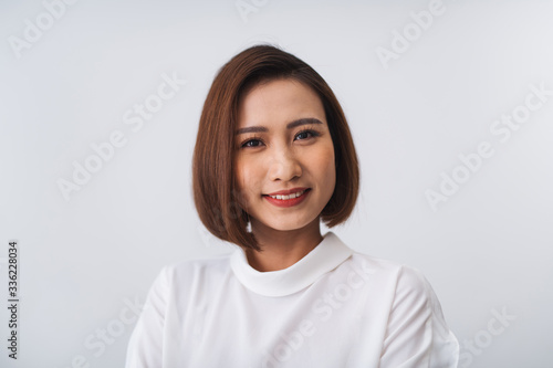 Beautiful woman smiling, isolated on white background photo