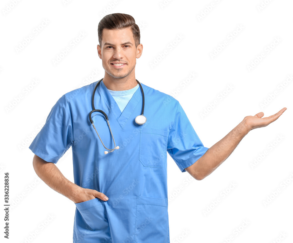 Portrait of young male doctor showing something on white background Portrait of young male doctor showing something on white background