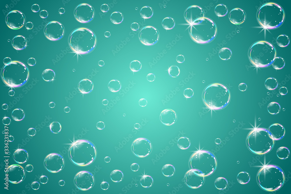 Soap bubbles sparkling on a turquoise background.