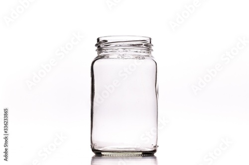 Wallpaper Mural Closeup shot of an empty glass jar isolated on a white background