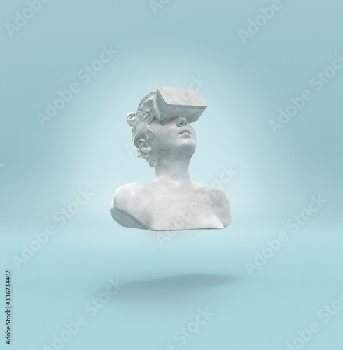 A marble female statue levitating with a virtual reality headset photo
