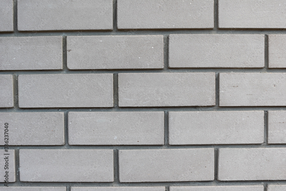 Texture of white silicate brick wall with cement mortar. Bricklaying background Texture of white silicate brick wall with cement mortar. Bricklaying background