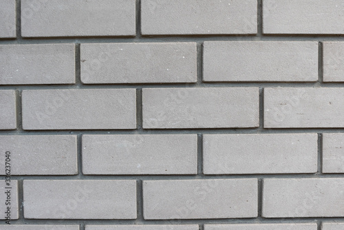 Texture of white silicate brick wall with cement mortar. Bricklaying background