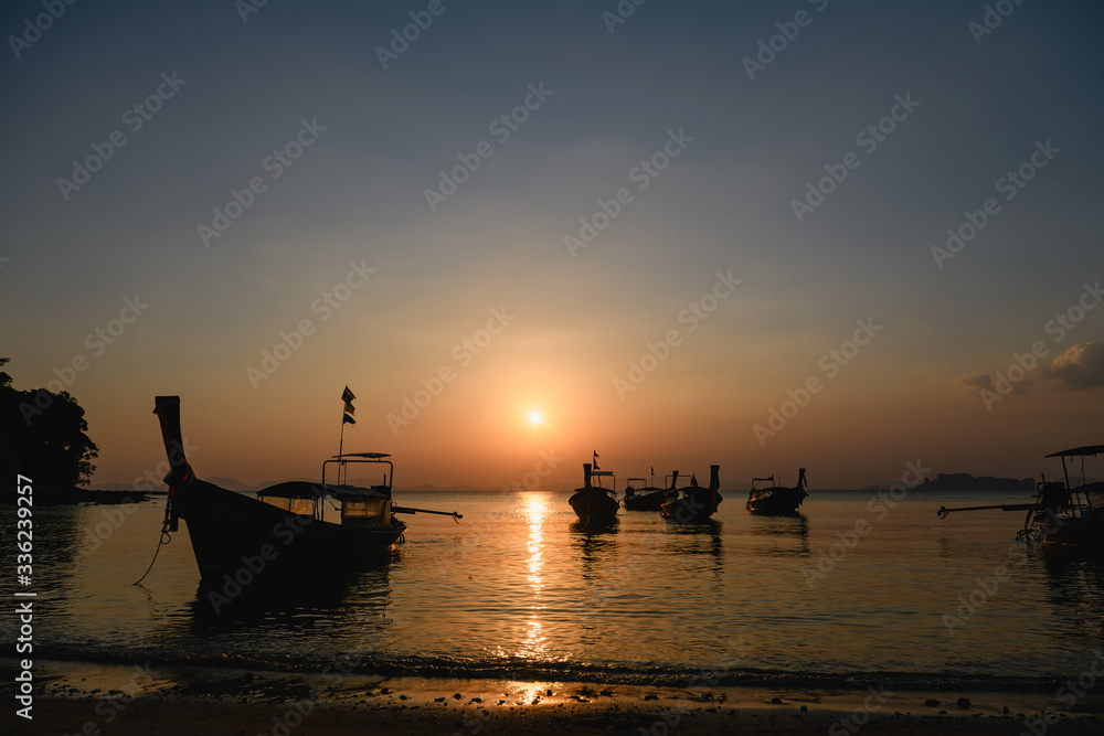 Boat creek with vessels silhouettes at evening