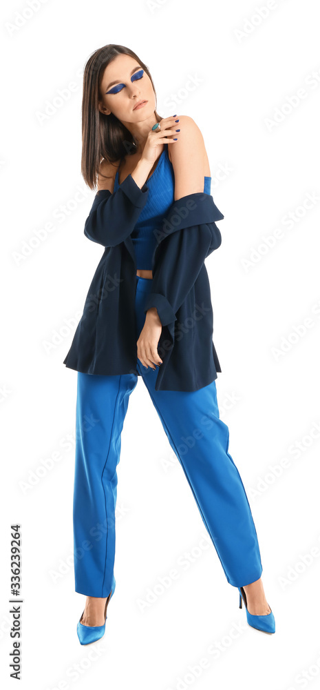 Obraz premium Portrait of fashionable young woman on white background