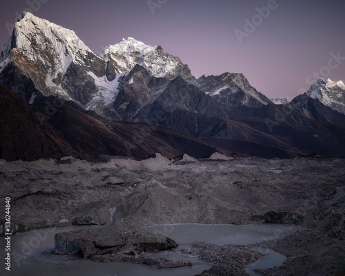 Ngozumpa Glacier and Cholaste in Nepal with Himalayan Alpenglow photo