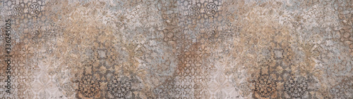 Old brown gray vintage shabby patchwork motif tiles stone concrete cement wall texture background banner	
