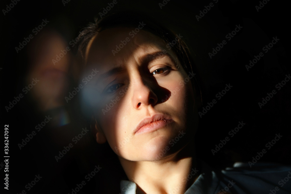 Portrait of the brunette girl seriously watching in the camera Portrait of the brunette girl seriously watching in the camera
